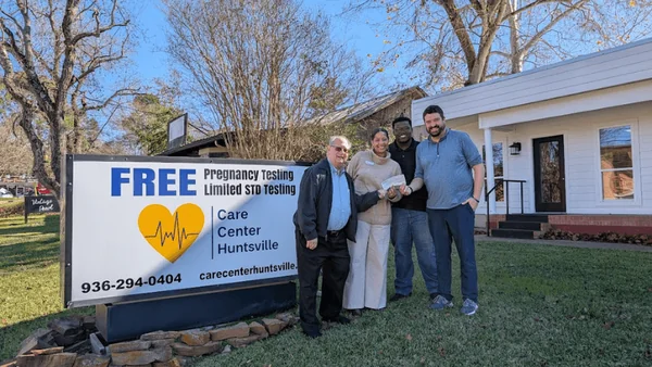 Hello Huntsville and Elliott's Jewelers Present $1,100 Check to Care Center