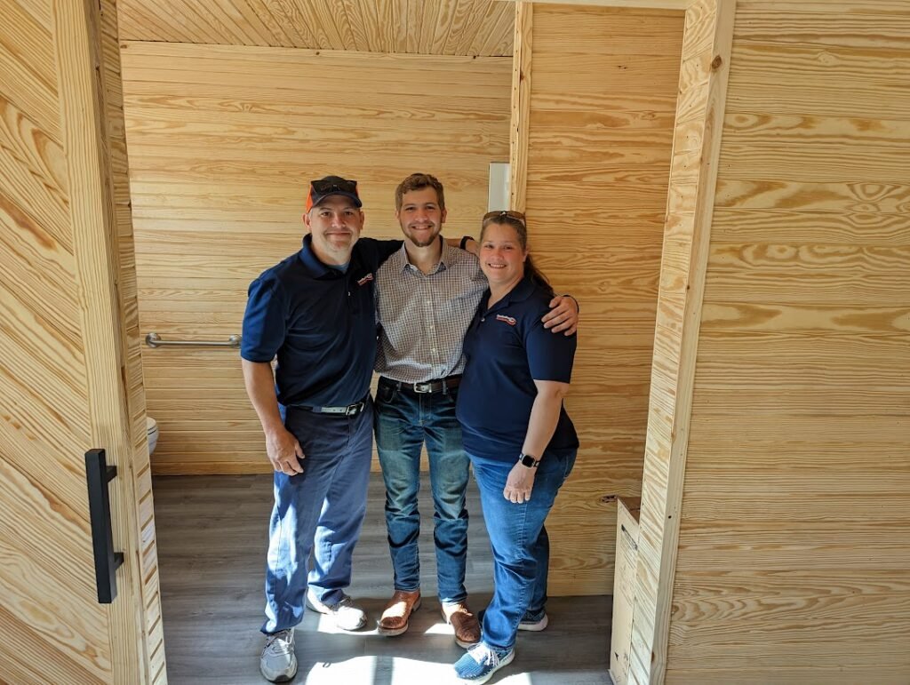 Zachary Crocker, a Junior CTE Student at Huntsville High School, along with his father, Jar, and mother Shiloh.