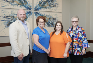 Staff Excellence Award recipients, Steven Koether, Debra Mikulin and Lacey Price take a photo with University President Alisa White.